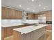 Modern kitchen featuring stainless steel appliances, light wood cabinets, a gas range, and white countertops at 867 Peachtree Ne St # 202, Atlanta, GA 30308