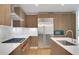 Modern kitchen featuring stainless steel appliances, light wood cabinets, a gas range, and white countertops at 867 Peachtree Ne St # 202, Atlanta, GA 30308