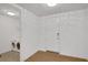 Clean laundry area featuring modern washer and dryer units and a door, all accented by light hardwood flooring at 867 Peachtree Ne St # 202, Atlanta, GA 30308