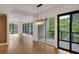 Spacious living room with hardwood floors and expansive windows offering abundant natural light at 867 Peachtree Ne St # 202, Atlanta, GA 30308