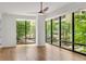 Bright living room featuring large windows with city views and hardwood floors at 867 Peachtree Ne St # 202, Atlanta, GA 30308