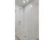The modern shower features bright white subway tiles and glass door at 867 Peachtree Ne St # 202, Atlanta, GA 30308