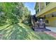 Home's backyard has multiple tiers, lush landscaping and mature trees at 1885 Milfield Cir, Snellville, GA 30078