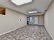 Finished basement featuring large windows, neutral walls, tiled flooring, and recessed lights at 1885 Milfield Cir, Snellville, GA 30078