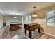 Finished basement with pool table, foosball table, recessed lights, and large windows at 1885 Milfield Cir, Snellville, GA 30078