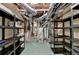 Unfinished basement has shelving for storage and exposed duct work at 1885 Milfield Cir, Snellville, GA 30078