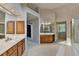 Bright and spacious main bathroom with tiled floor, jacuzzi tub, glass shower, and double sink vanity at 1885 Milfield Cir, Snellville, GA 30078