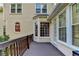 Wooden deck on the exterior with yellow siding and window views to the interior at 1885 Milfield Cir, Snellville, GA 30078