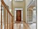 Inviting foyer with hardwood floors, staircase, and a solid wood front door with sidelights, offering a warm welcome at 1885 Milfield Cir, Snellville, GA 30078