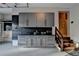 Garage featuring custom cabinets, a utility sink, and epoxy flooring at 1885 Milfield Cir, Snellville, GA 30078