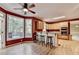 Bright kitchen with wooden cabinets and a breakfast bar overlooking an outdoor deck at 1885 Milfield Cir, Snellville, GA 30078