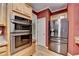Kitchen with stainless steel appliances including a refrigerator and double ovens at 1885 Milfield Cir, Snellville, GA 30078