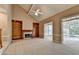 Bright living room with fireplace, built-in shelving, and natural light from the doors at 1885 Milfield Cir, Snellville, GA 30078