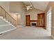 Spacious living room with high ceilings, a fireplace, and built-in bookshelves at 1885 Milfield Cir, Snellville, GA 30078