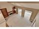 Bright living room with fireplace, built-in shelves, and adjacent sunroom filled with natural light at 1885 Milfield Cir, Snellville, GA 30078
