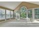 Sunroom with neutral paint and large windows for natural light and beautiful views at 1885 Milfield Cir, Snellville, GA 30078