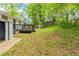 Backyard featuring a shed, deck, and a large sloping yard at 2499 Shiloh Dr, Decatur, GA 30034