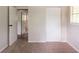 Bedroom with carpeted floors, an open door, and a bi-fold closet at 2499 Shiloh Dr, Decatur, GA 30034