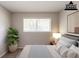Staged bedroom with carpeted floors and a window overlooking a treed landscape at 2499 Shiloh Dr, Decatur, GA 30034