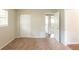 Bedroom featuring neutral carpeting, window, and door to another room at 2499 Shiloh Dr, Decatur, GA 30034