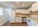 Efficient kitchen featuring white cabinets, stainless steel appliances, and modern finishes at 2499 Shiloh Dr, Decatur, GA 30034