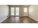 Bright living room featuring modern flooring, natural light, and access to outdoor deck at 2499 Shiloh Dr, Decatur, GA 30034