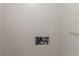 Utility room with an electrical outlet, plumbing box, and a blank wall at 2499 Shiloh Dr, Decatur, GA 30034