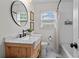 Bright bathroom featuring natural light, updated vanity, and a shower/tub combination at 3843 Lake Se Dr, Smyrna, GA 30082