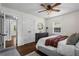 Bright bedroom featuring wood floors, natural light, and updated closet with double doors at 3843 Lake Se Dr, Smyrna, GA 30082