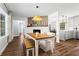 Open-concept dining room flows into the kitchen and living room with hardwood floors at 3843 Lake Se Dr, Smyrna, GA 30082