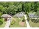 Beautiful aerial shot of a single-story home featuring a well-maintained lawn and mature trees at 402 Johannah Sw Pl, Lilburn, GA 30047