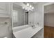 This bathroom has white vanity and a large mirror at 402 Johannah Sw Pl, Lilburn, GA 30047