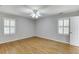 Bright bedroom featuring hardwood floors and bright windows at 402 Johannah Sw Pl, Lilburn, GA 30047