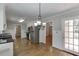Well lit kitchen offers stainless appliances, granite counters and beautiful hardwood floors at 402 Johannah Sw Pl, Lilburn, GA 30047