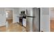 Bright kitchen with stainless appliances, sleek oven and hardwood floors at 402 Johannah Sw Pl, Lilburn, GA 30047