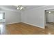 Spacious room featuring gleaming hardwood floors and lots of natural light at 402 Johannah Sw Pl, Lilburn, GA 30047