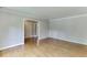 Bright and airy living room featuring hardwood floors and neutral paint, awaiting personal touches at 402 Johannah Sw Pl, Lilburn, GA 30047