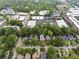 Aerial view showcases a neighborhood with lush trees, charming homes, and urban landscape at 622 Seminole Ne Ave, Atlanta, GA 30307