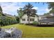 Private backyard featuring a lounge area, lush green grass, and a stylish seating area at 622 Seminole Ne Ave, Atlanta, GA 30307