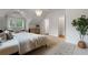 Bedroom featuring stylish furnishings and multiple windows for natural light and a modern light fixture at 622 Seminole Ne Ave, Atlanta, GA 30307