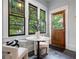 Cozy breakfast nook filled with sunlight and a view to a serene garden setting at 622 Seminole Ne Ave, Atlanta, GA 30307