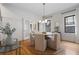 Bright dining room features stylish light fixture and seating for six with hardwood floors at 622 Seminole Ne Ave, Atlanta, GA 30307