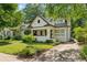 Charming renovated bungalow with fresh white paint, updated landscaping, and brick driveway at 622 Seminole Ne Ave, Atlanta, GA 30307