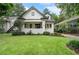 Beautifully landscaped yard and classic bungalow exterior with a freshly cut green lawn at 622 Seminole Ne Ave, Atlanta, GA 30307