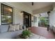 Inviting outdoor living space with comfortable seating, tiled floors, and stylish decor at 622 Seminole Ne Ave, Atlanta, GA 30307