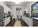 Modern kitchen features stainless appliances, white cabinets, and eat-in breakfast nook at 622 Seminole Ne Ave, Atlanta, GA 30307