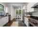 Well-appointed kitchen features stainless appliances, white cabinets, and an eat-in breakfast nook at 622 Seminole Ne Ave, Atlanta, GA 30307