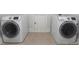 Laundry room with modern, front-load washer and dryer at 622 Seminole Ne Ave, Atlanta, GA 30307