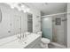 Modern bathroom with sleek vanity, large mirror, and a glass-enclosed shower at 742 Redland Dr, Jonesboro, GA 30238