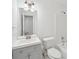 Bathroom with a gray vanity, large mirror, and a combined tub and shower at 742 Redland Dr, Jonesboro, GA 30238